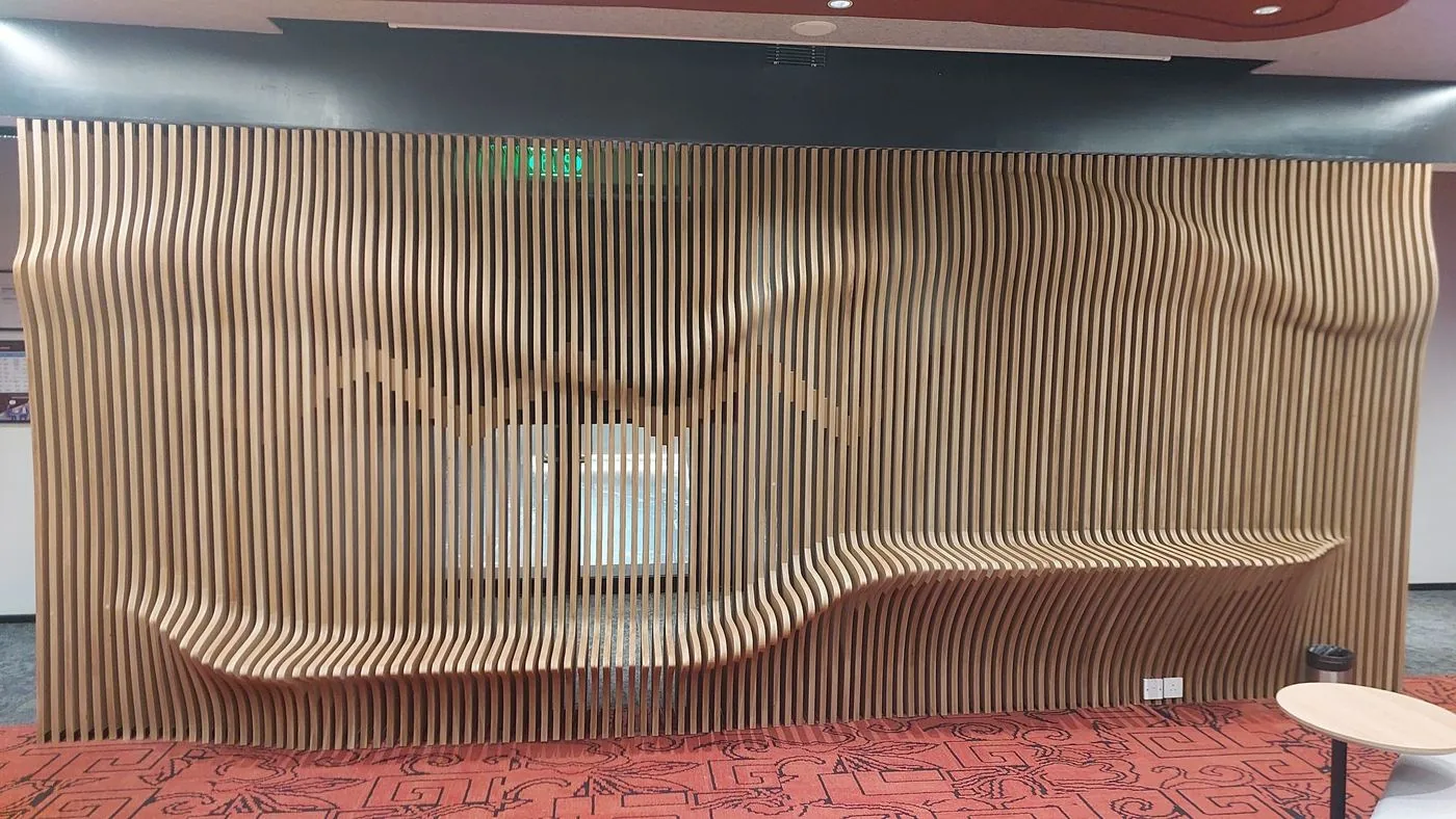 Full view of the sculpted timber fin wall with built-in seating at the IntraEdge office